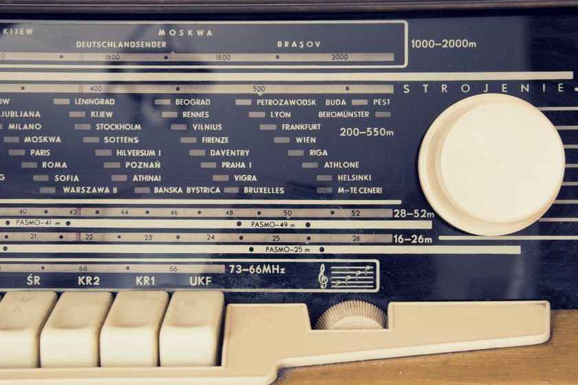 A shortwave receiver dial lit at dusk, tuned near the 31 metre broadcast band